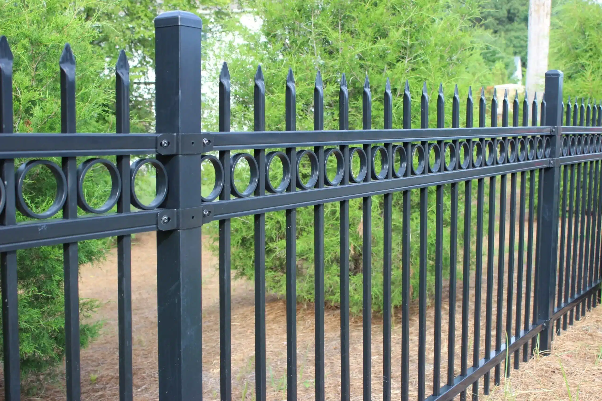 Black decorative steel fence with circles
