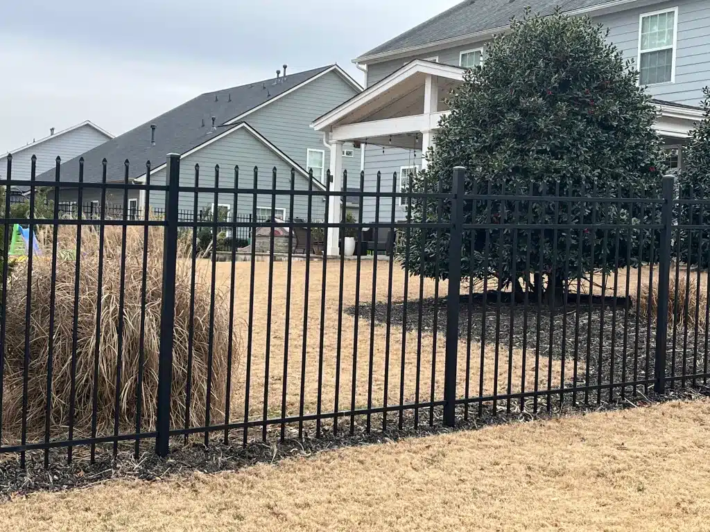 Residential fencing installed in a suburban backyard by Sandy Springs fence company, Chamblee Fence.