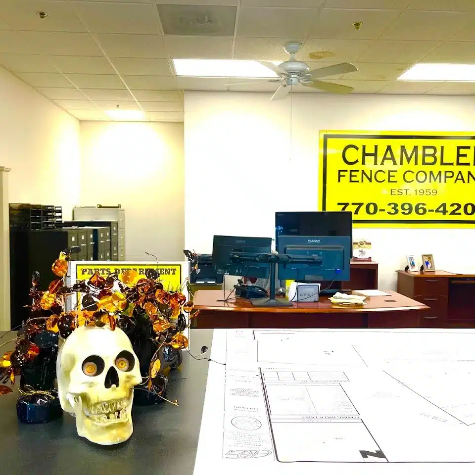 Lawrenceville homeowner reviewing building permit paperwork and site plans for a new fence installation.