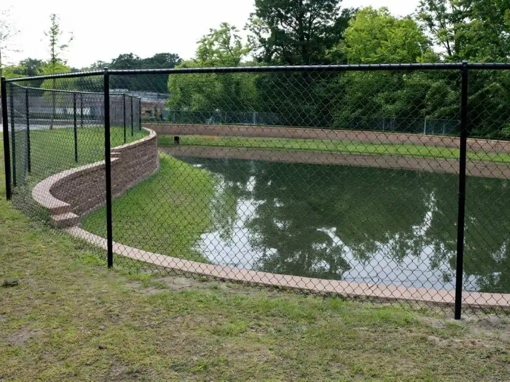 chain link fence installed along water in Alpharetta Georgia