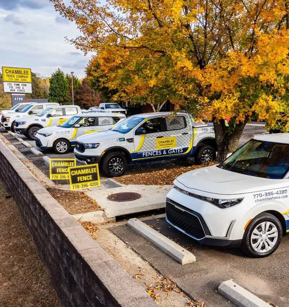 Chamblee Fence Company service vehicles in a parking lot