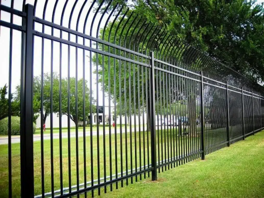 Black steel fence with curved top
