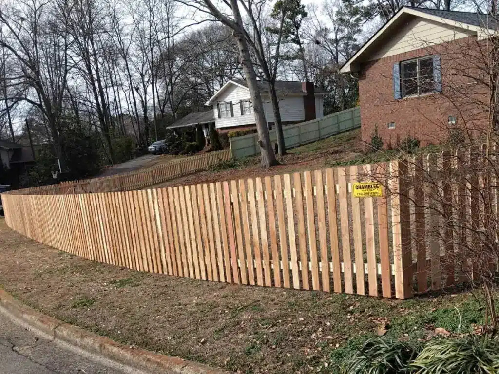 Wood picket fence installed along a residential front yard in Marietta, GA